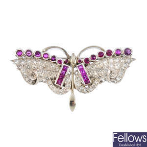 A mid 20th century diamond and ruby butterfly double clip brooch.