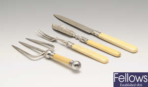 Assorted ivory handled flatware, together with three pairs of sugar nips, a Scottish snuffer, a silver-handled brush etc.