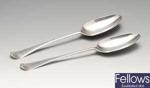 Three George II/III Hanoverian table spoons & five George III Fiddle Shell pattern dessert spoons. (8).