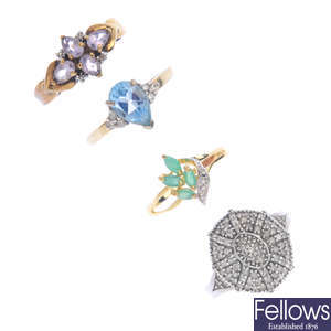 Four diamond and gem-set rings.