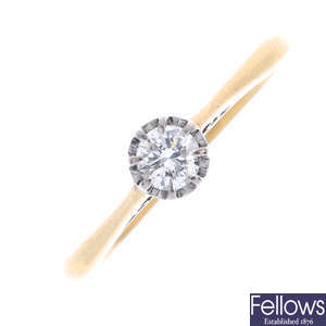 A platinum and 18ct gold diamond single-stone ring.