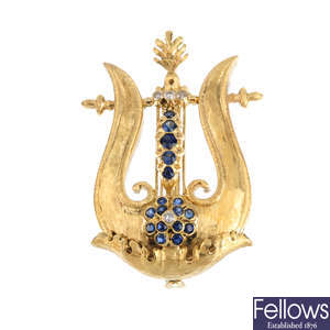A diamond and sapphire lyre brooch.