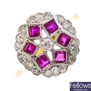 A diamond and ruby floral cluster ring.