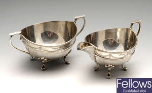 An early twentieth century silver twin-handled sugar bowl & matching cream jug.