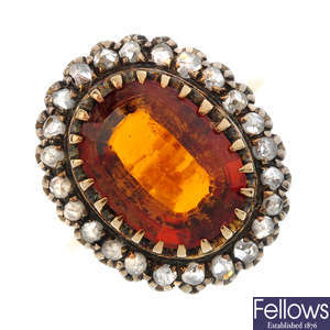 A citrine and diamond cluster ring.