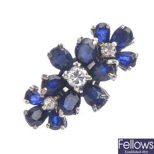 A diamond and sapphire floral dress ring.