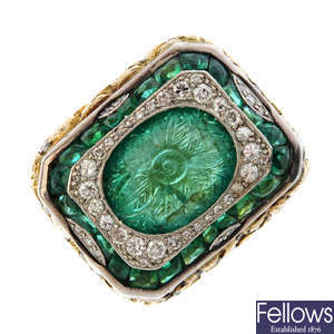 An emerald and diamond carved dress ring.