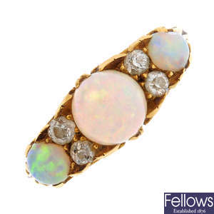An early 20th century opal and diamond three-stone ring.