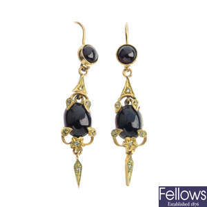 A pair of garnet and diamond drop earrings.