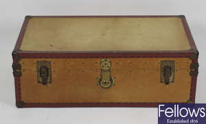 A yellow hide covered travel or cabin trunk of rectangular form.
