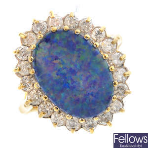 An 18ct gold opal triplet and diamond cluster ring.