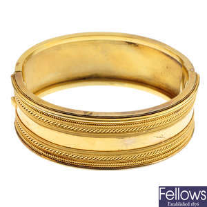 A late Victorian gold hinged bangle.