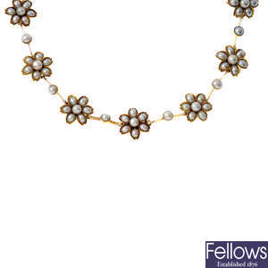 A late Victorian gold, cultured and split pearl floral necklace.