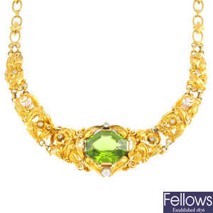 An Arts & Crafts gold, peridot, diamond and seed pearl necklace.