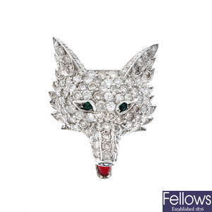 A gem-set fox mask brooch.