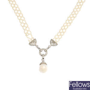 A natural saltwater pearl, diamond and seed pearl necklace.