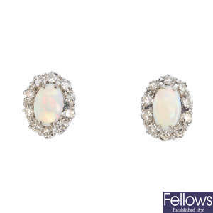 A pair of opal and diamond cluster earrings.
