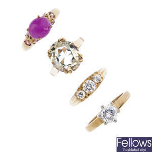 Four 9ct gold gem-set and rings.