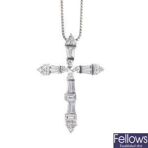 An 18ct gold diamond cross pendant, with chain.