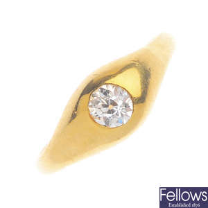 An 18ct gold diamond ring and a pair of earrings.