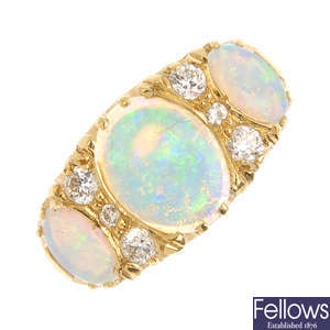 An 18ct gold opal three-stone and diamond ring.