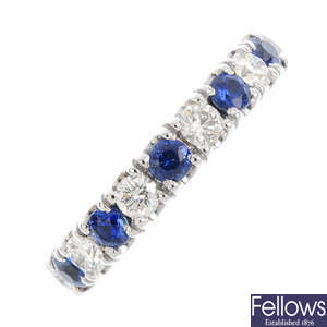 An 18ct gold diamond and sapphire half eternity ring.