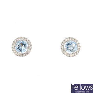 A pair of 18ct gold aquamarine and diamond cluster earrings.