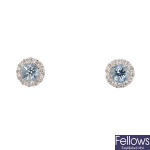A pair of 18ct gold aquamarine and diamond stud earrings.