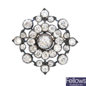 A late Victorian silver and gold diamond cluster brooch.