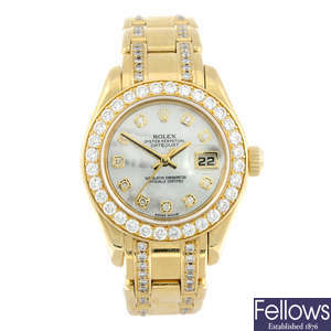 ROLEX - a lady's 18ct yellow gold Oyster Perpetual Datejust Pearlmaster bracelet watch.