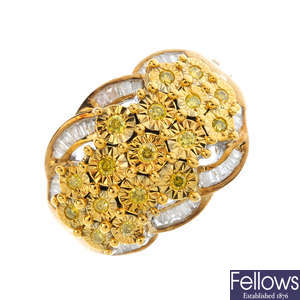 A 9ct gold diamond and colour treated diamond dress ring.
