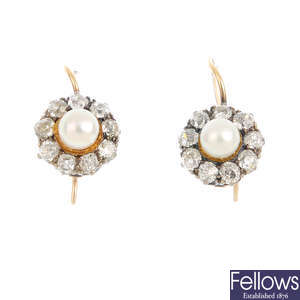 A pair of mid 20th century seed pearl and diamond cluster earrings.