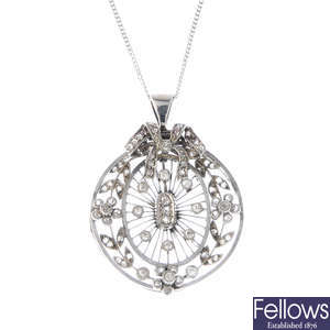An early 20th century platinum diamond pendant, with later 18ct gold chain.