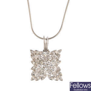 An 18ct gold diamond pendant, with platinum De Beers chain.