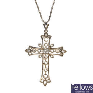 A diamond cross pendant with chain.