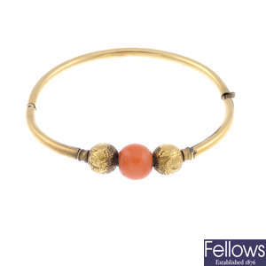 A late 19th century gold coral bangle.