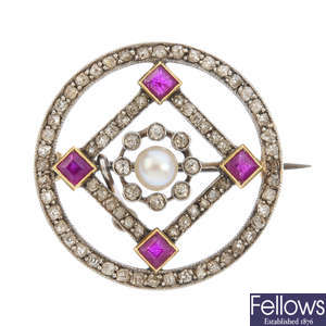 An early 20th century platinum and gold pearl, ruby and diamond brooch.
