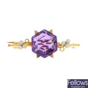 A gold, amethyst and seed pearl bar brooch.