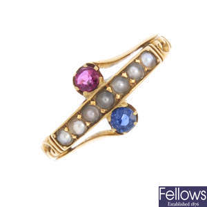An early 20th century 18ct gold, ruby, sapphire and split pearl ring.