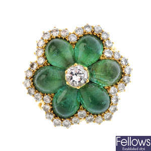 An emerald and diamond floral cluster ring.