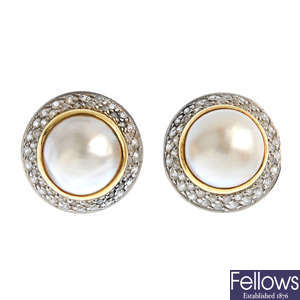 A pair of mabe pearl and cubic zirconia cluster earrings.