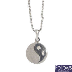A diamond Yin Yang pendant, with chain.