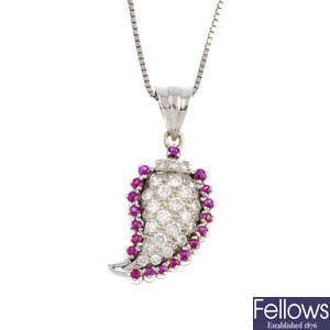 A diamond and ruby pendant, with chain.