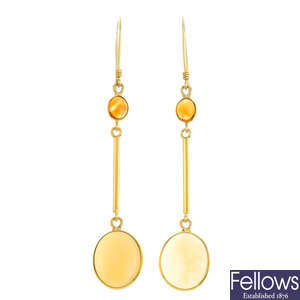 A pair of opal and citrine earrings.