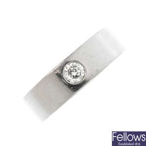A palladium diamond band ring.