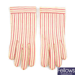 HERMÈS - a pair of vintage striped gloves.