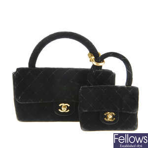 CHANEL - two black velvet Kelly Flap handbags.