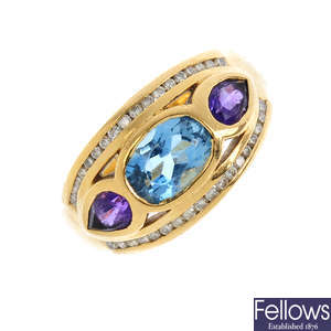 An 18ct gold diamond and gem set dress ring.
