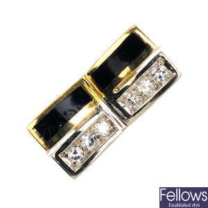 A 1970s 18ct gold diamond and black enamel dress ring.