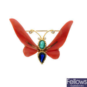 A coral, emerald, sapphire and diamond butterfly brooch.
